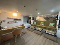 Nail treatment area with manicure desk and pedicure seats at 7 Day Spa