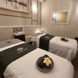 Couples massage room with two treatment beds at 7 Day Spa